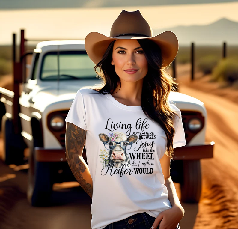 Living Life Somewhere Between Jesus Take the Wheel I Wish Heifer Would Shirt, Country Mama Shirt, Cow Lover Shirt, Farmer Life Shirt