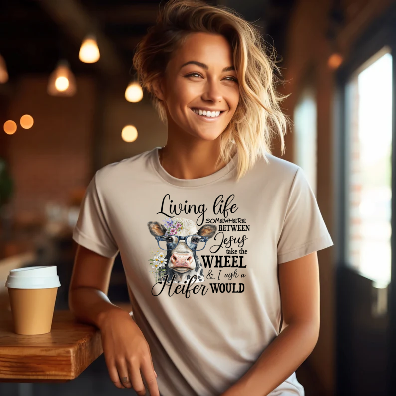 Living Life Somewhere Between Jesus Take the Wheel I Wish Heifer Would Shirt, Country Mama Shirt, Cow Lover Shirt, Farmer Life Shirt